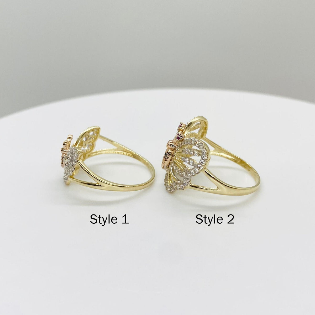 Two 14k gold butterfly rings side view labeled Style 1 and Style 2 on a white background
