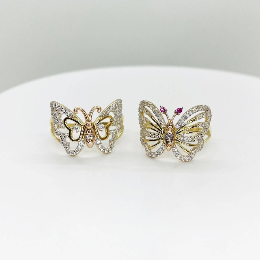 two 14k Butterfly shaped rings with Cubic Zirconia on a white background