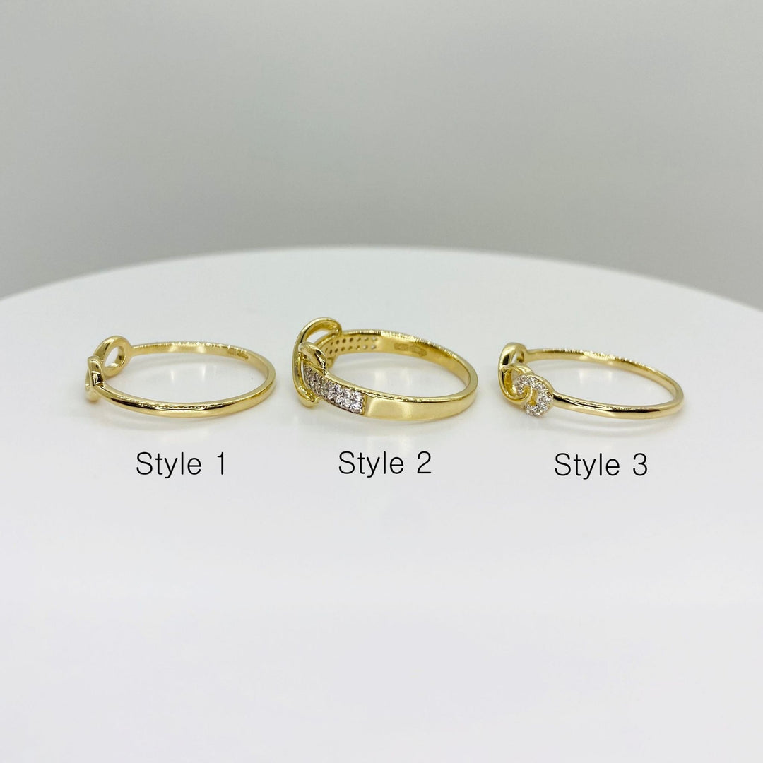 Three 14k gold infinity rings sideview labeled Style 1, Style 2, and Style 3 