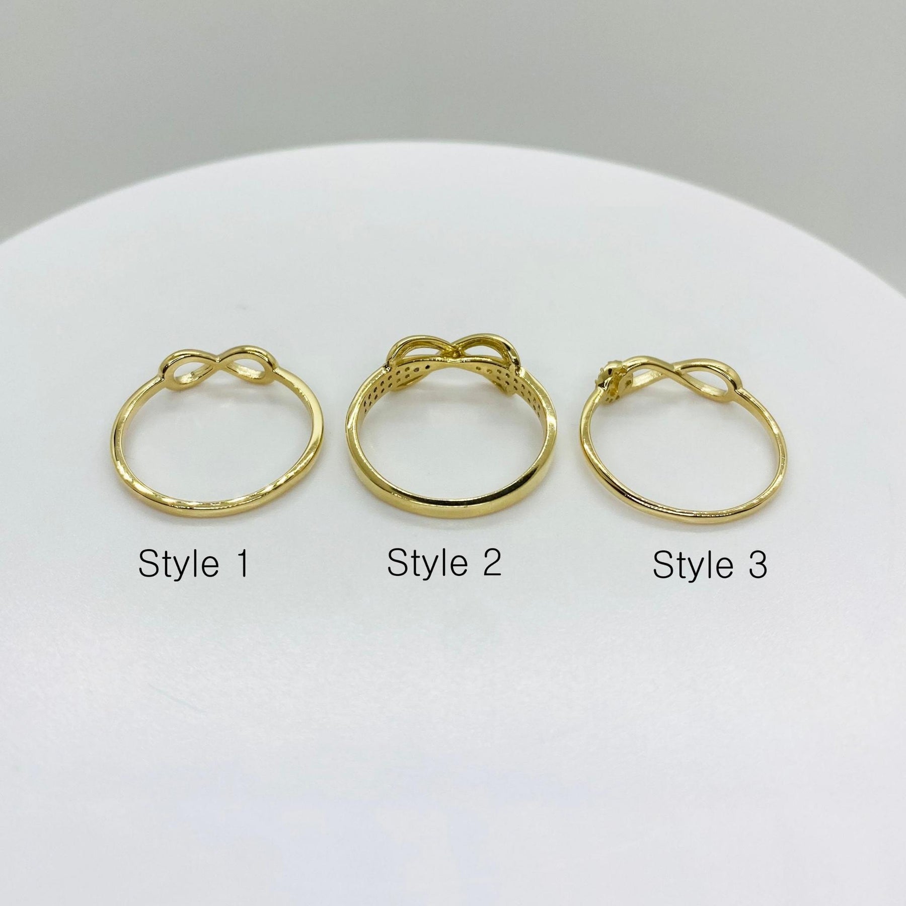 Three 14k Gold Assorted Infinity Sign back view with three different design