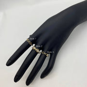 Black mannequin hand wearing three 14k  Infinity gold ring with different styles on a white background