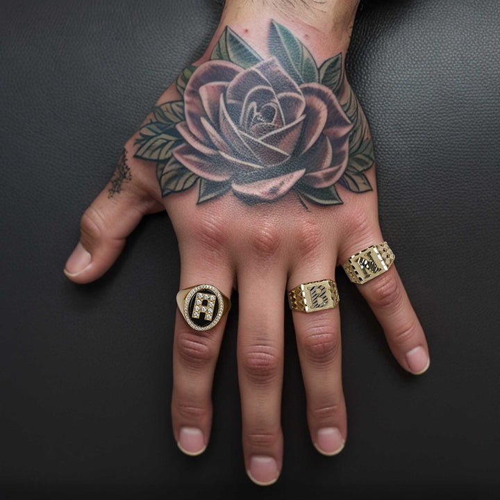 Model showcasing the 14k Gold Initial Onyx Enigma Ring styled with other gold rings.