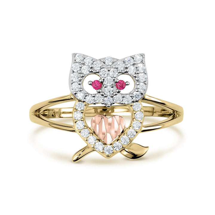 Two-tone gold owl ring featuring a rose gold heart and white crystal body.