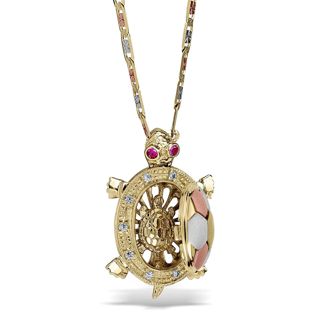 14k tricolor gold turtle pendant hanging from a decorated chain with red crystal eyes.
