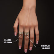 Model's hand wearing small and medium gold Mary butterfly rings with millimeter size labels.