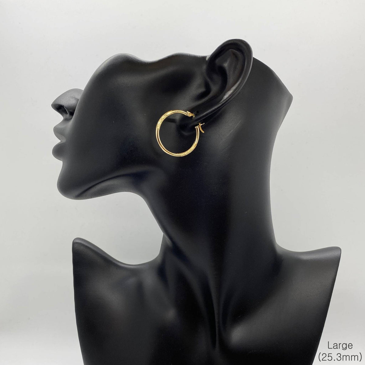 Large 25.3mm 14k gold hoop earring featuring a 2mm tube and matte finish.