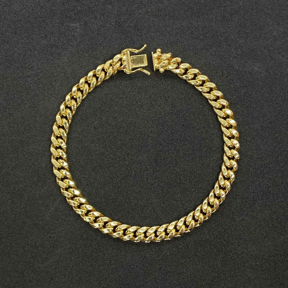 Exquisite 14k gold Miami Cuban bracelet showcasing a timeless, high-shine interlocking link design.