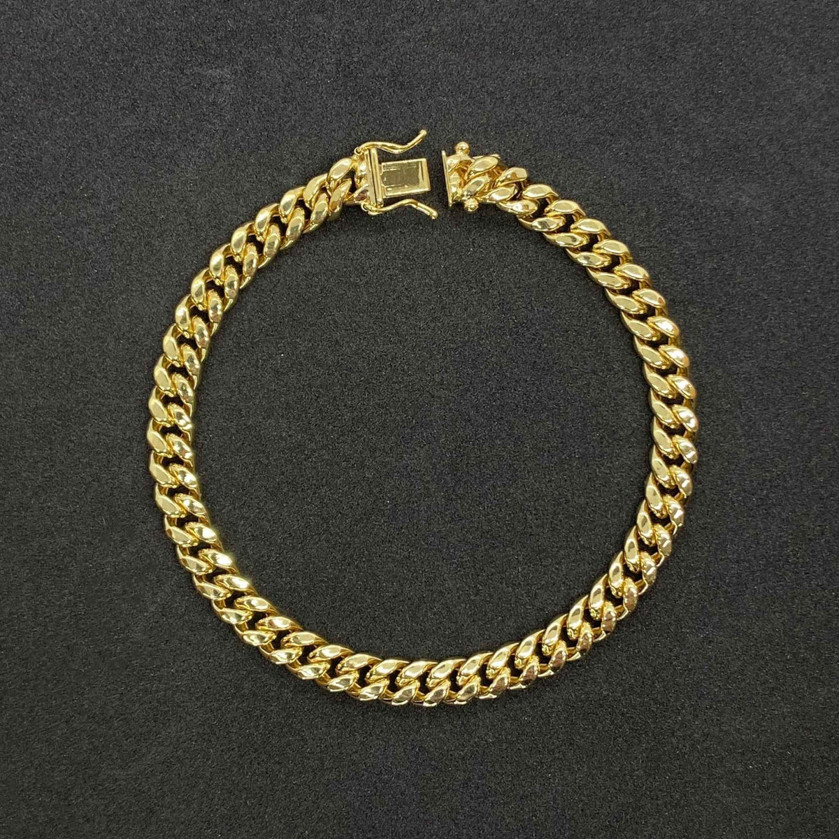 Exquisite 14k gold Miami Cuban bracelet showcasing a timeless, high-shine interlocking link design.