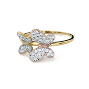 Profile view of a slim gold band featuring overlapping yellow and rose gold butterflies.