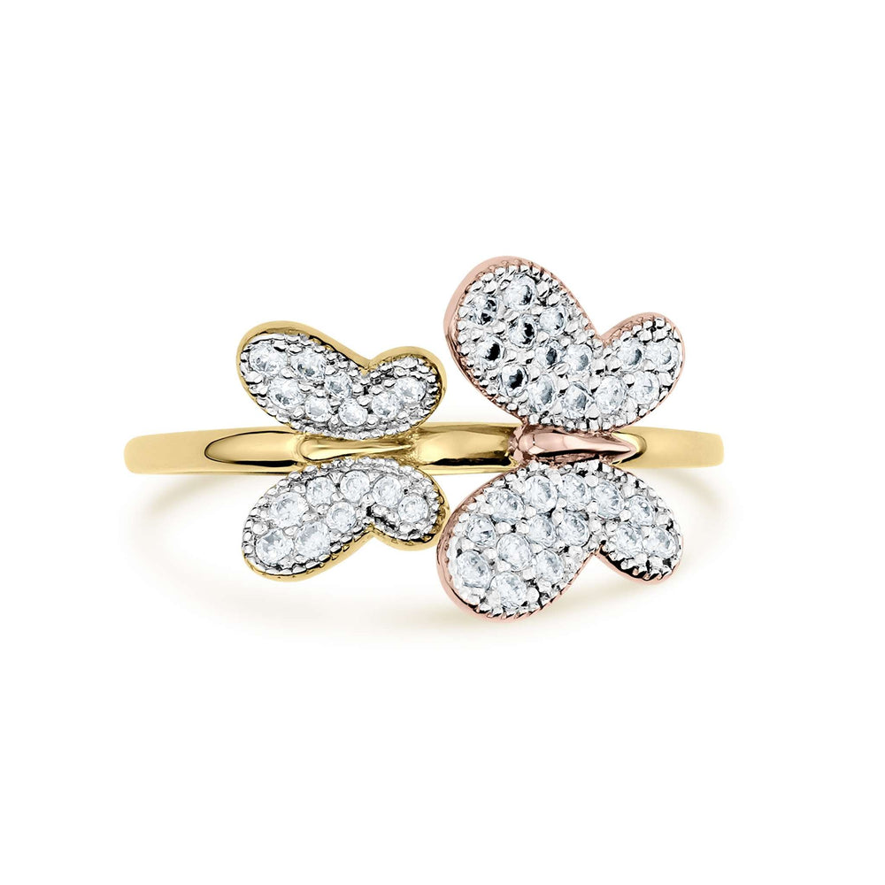Two-tone gold butterfly ring with shimmering clear gemstones on a white background.