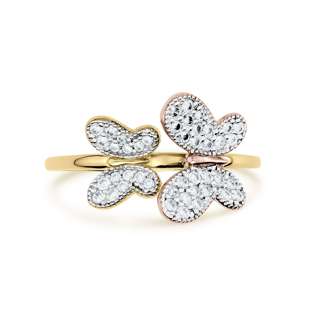 Two-tone gold butterfly ring with shimmering clear gemstones on a white background.