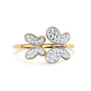 Two-tone gold butterfly ring with shimmering clear gemstones on a white background.