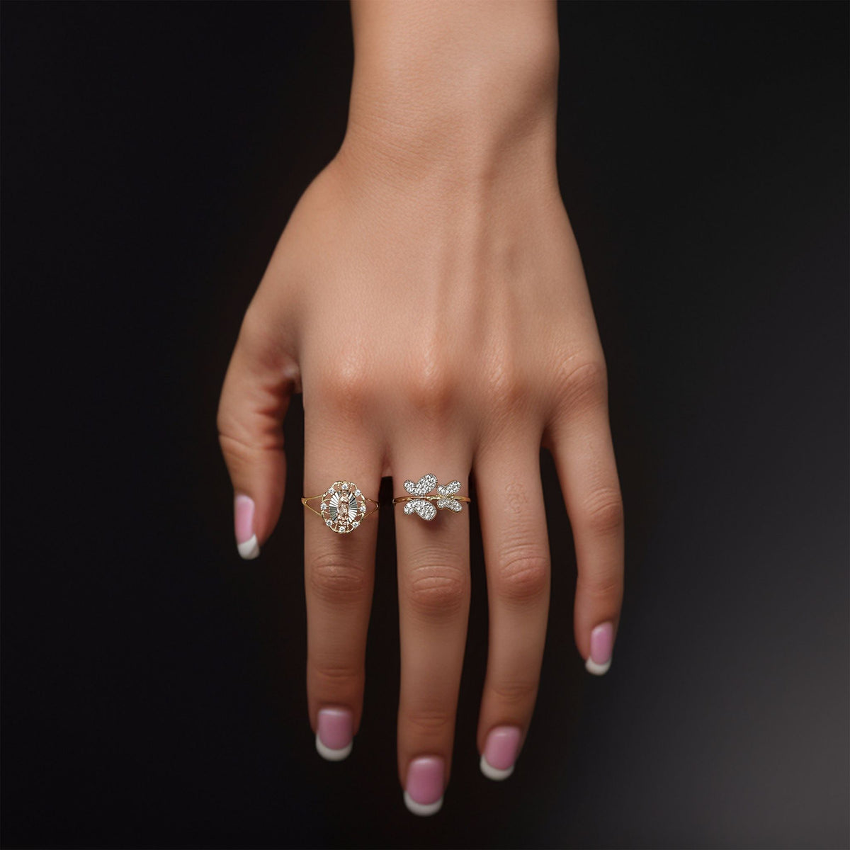 14k gold miley slim butterfly two-tone CZ ring worn on a hand.