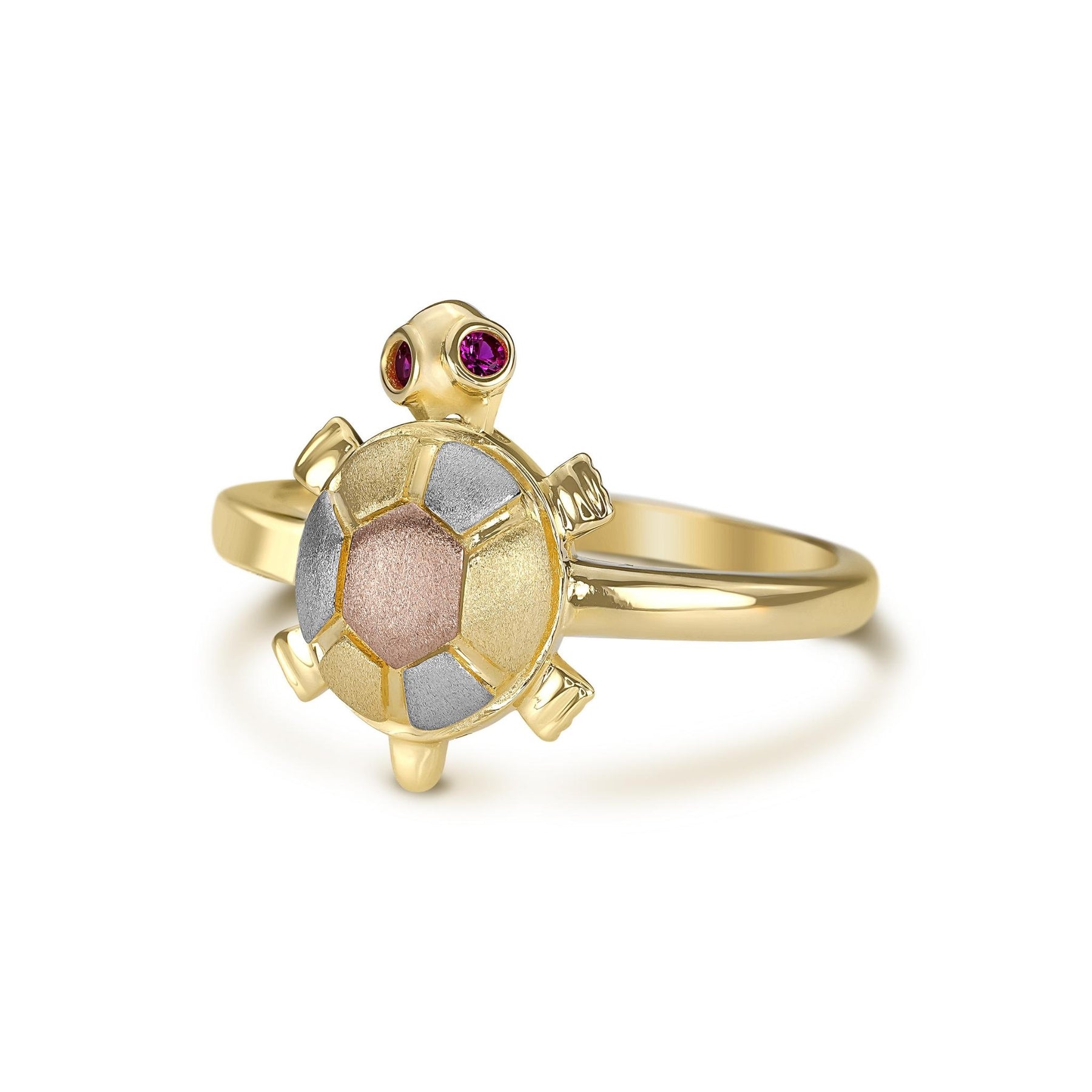 Angled view of a tri-color gold turtle ring with pink eyes on white background.
