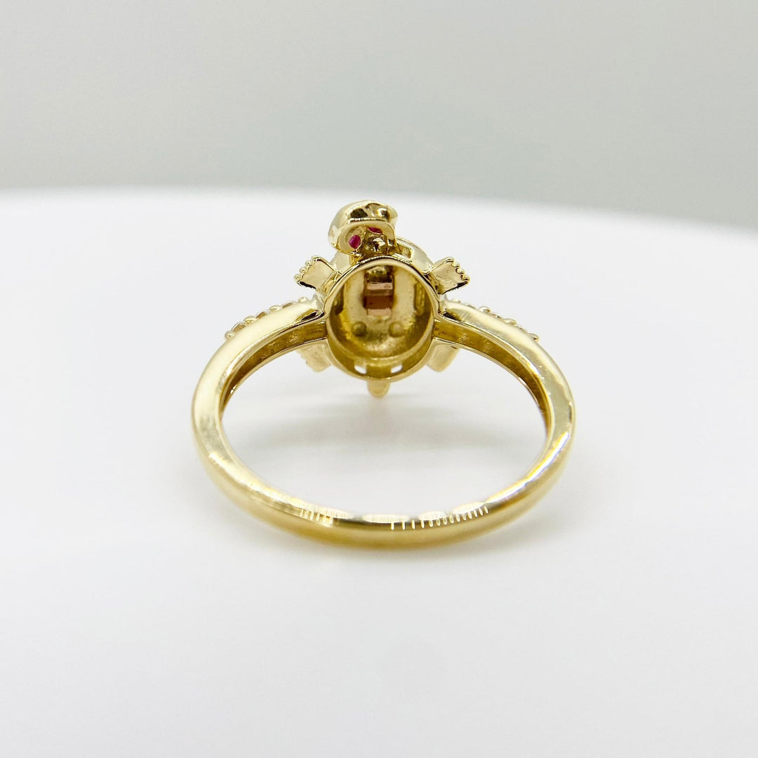 14k Gold ring with a mini turtle design back view on a white background