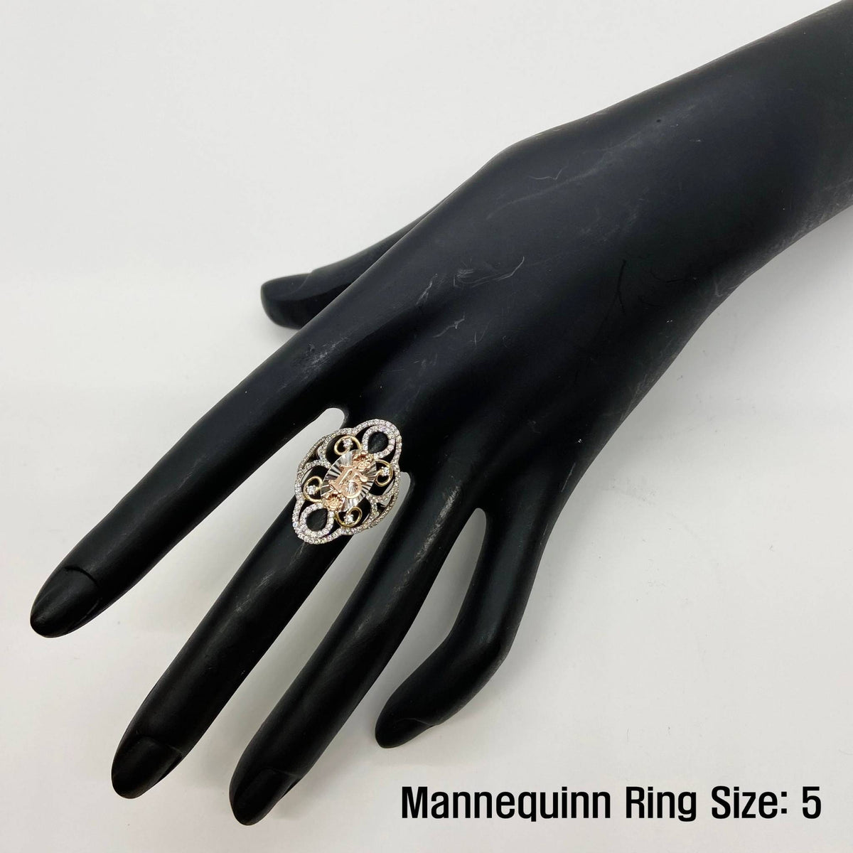 14k gold Quinceanera ring on a black mannequin hand with text indicating ring size 5.