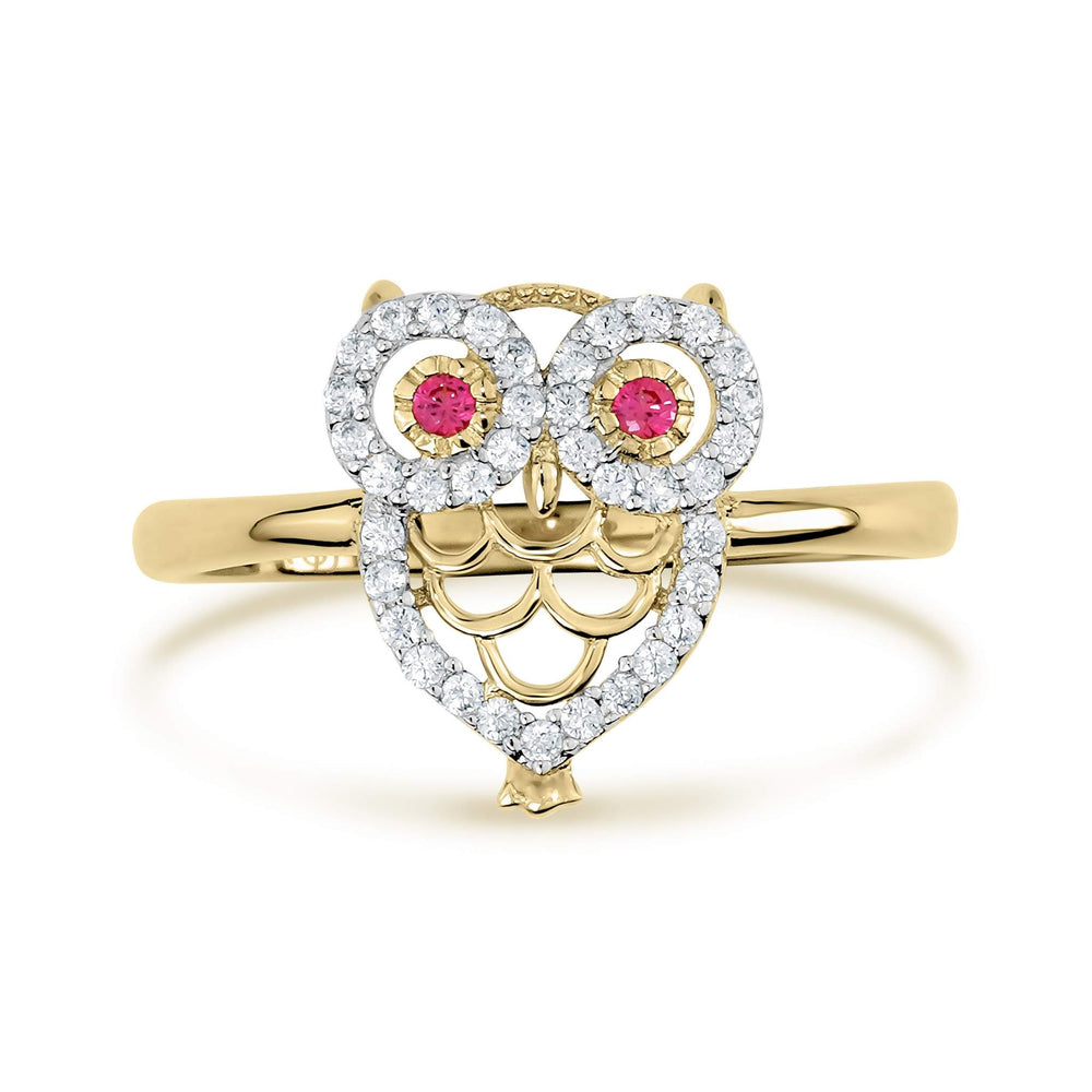 Yellow gold owl ring featuring a heart-shaped body encrusted with white cubic zirconia.
