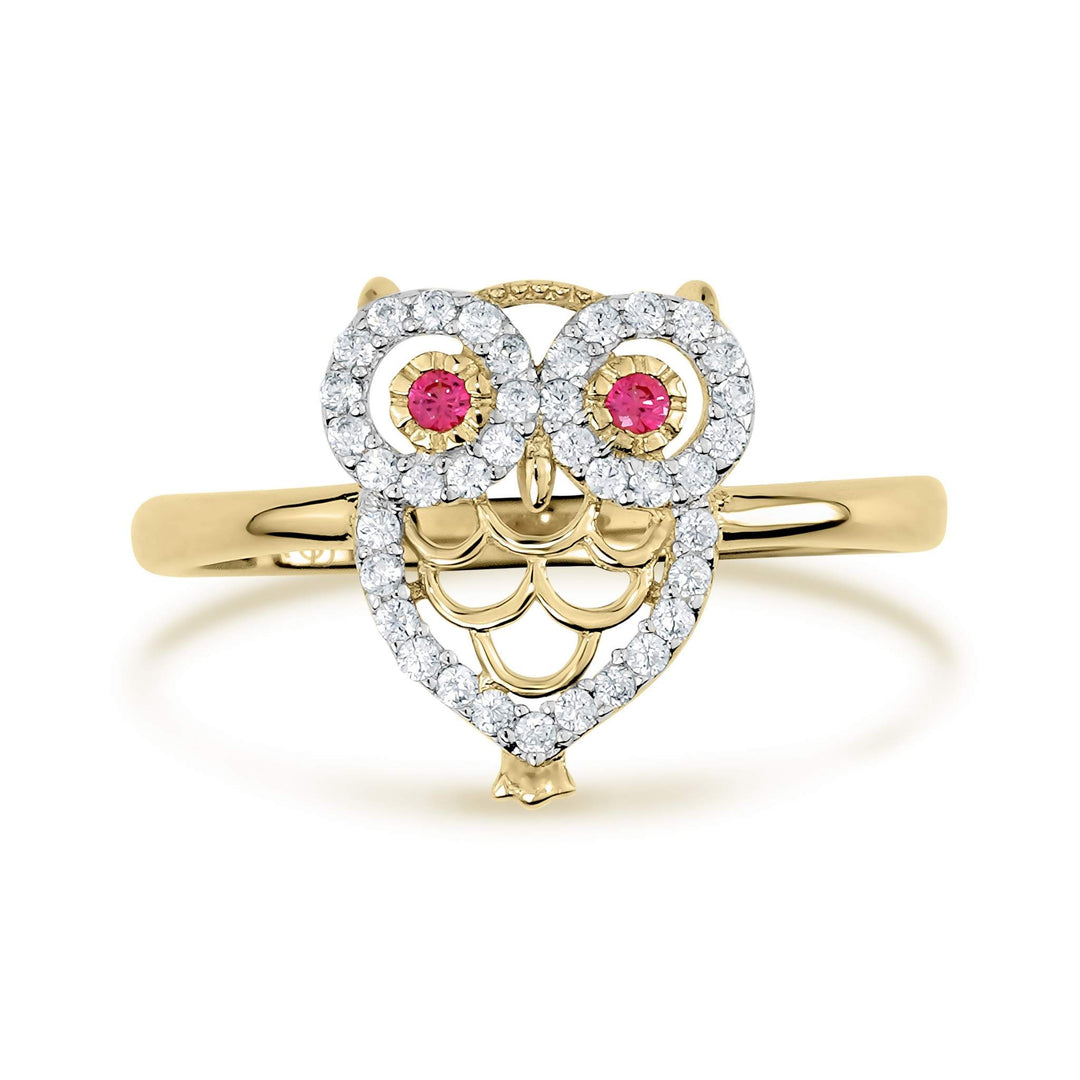 Yellow gold owl ring featuring a heart-shaped body encrusted with white cubic zirconia.