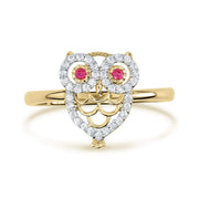 Yellow gold owl ring featuring a heart-shaped body encrusted with white cubic zirconia.