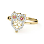 Side-angled view of 14k gold noir mini owl CZ ring on white background.