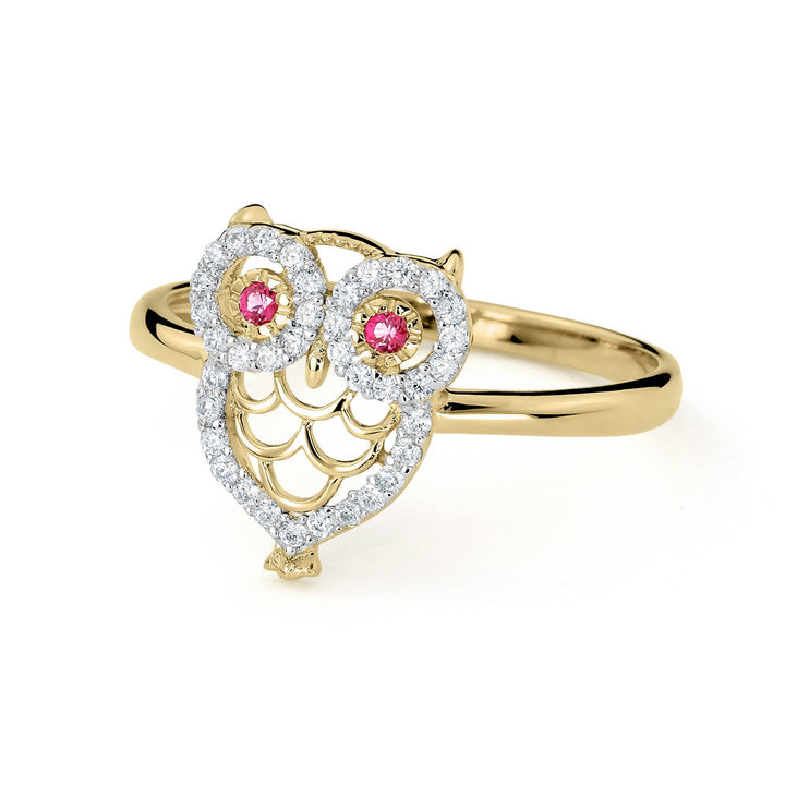 Side-angled view of 14k gold noir mini owl CZ ring on white background.
