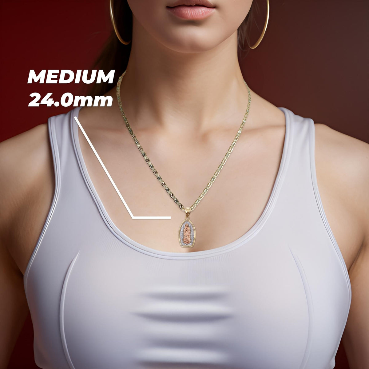A model wearing the medium tri-color gold Guadalupe pendant highlighting the 24.0mm size.