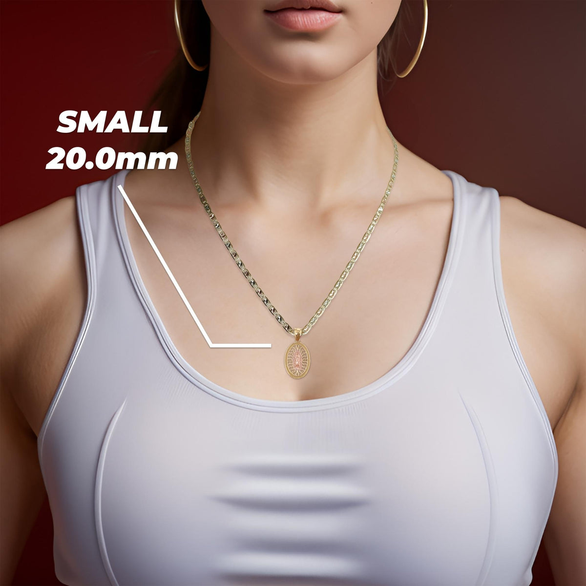 A model wearing the small two-tone gold Guadalupe pendant highlighting the 20.0mm size.