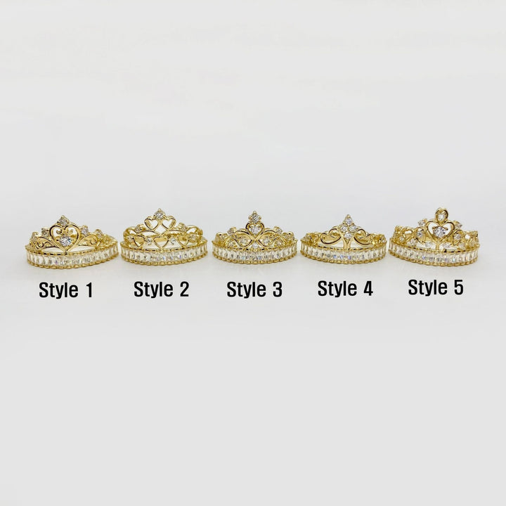 Five 14k gold tiara style rings with varying designs on a white background