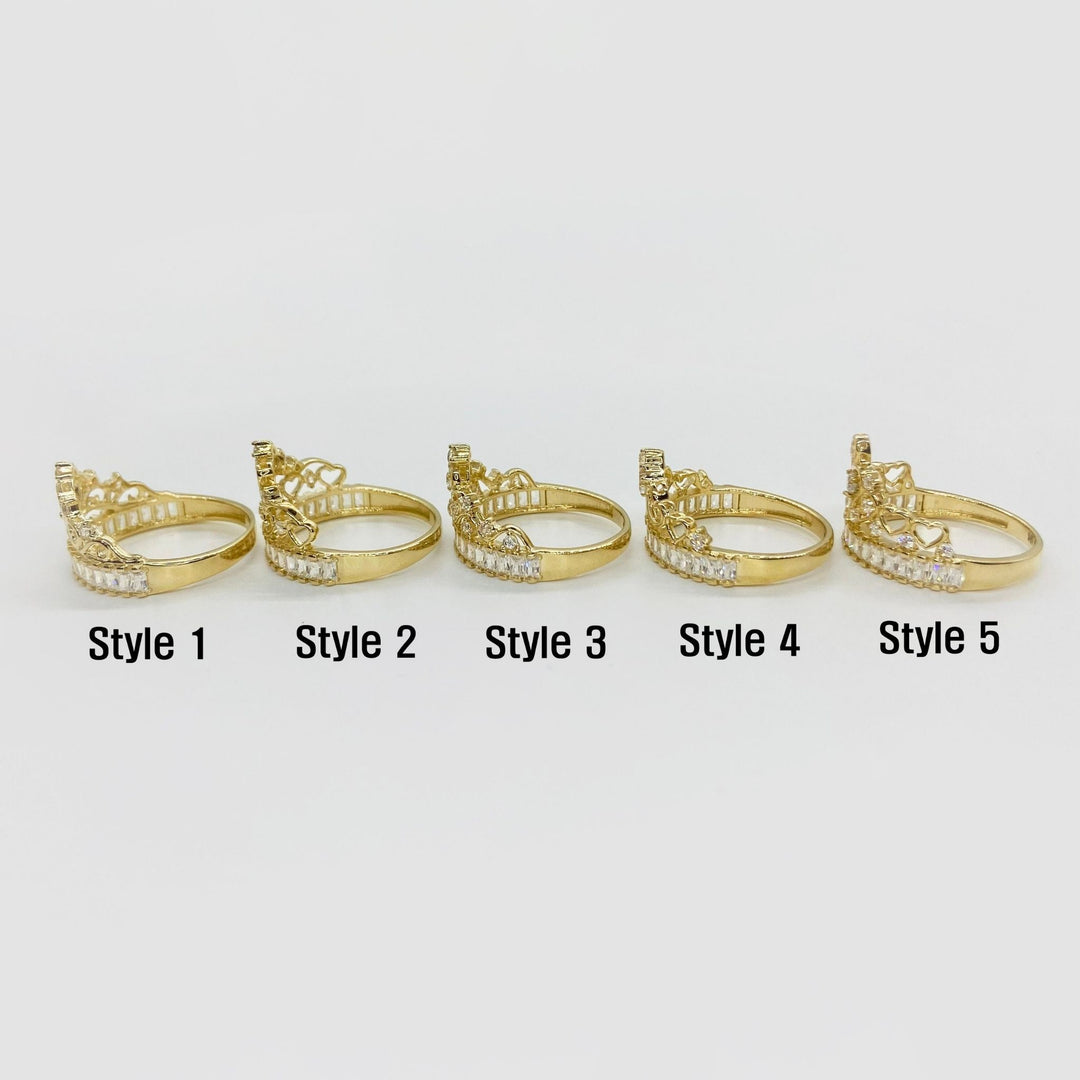 Five 14k gold rings with different crown designs side view on a white background