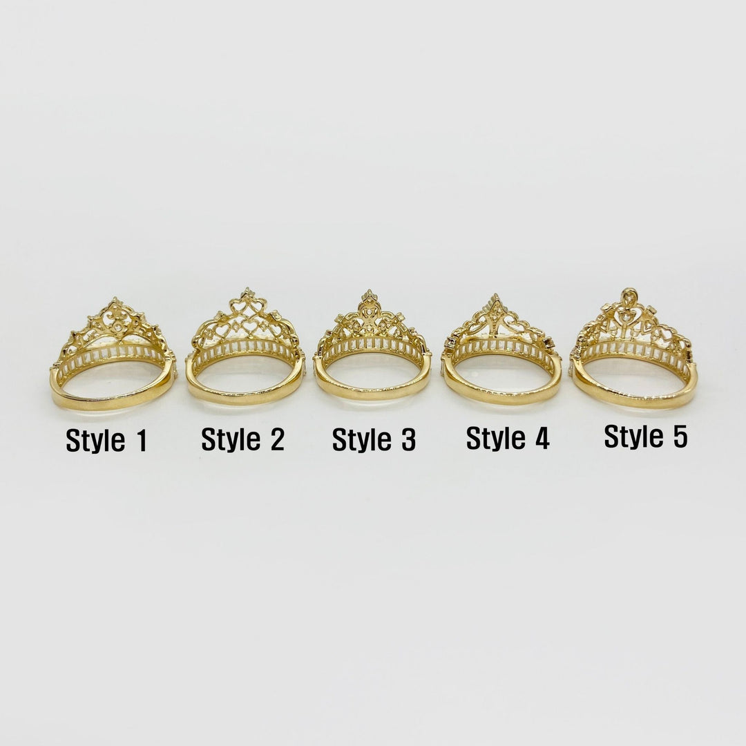 Five 14k gold tiara-style rings back view on a white background