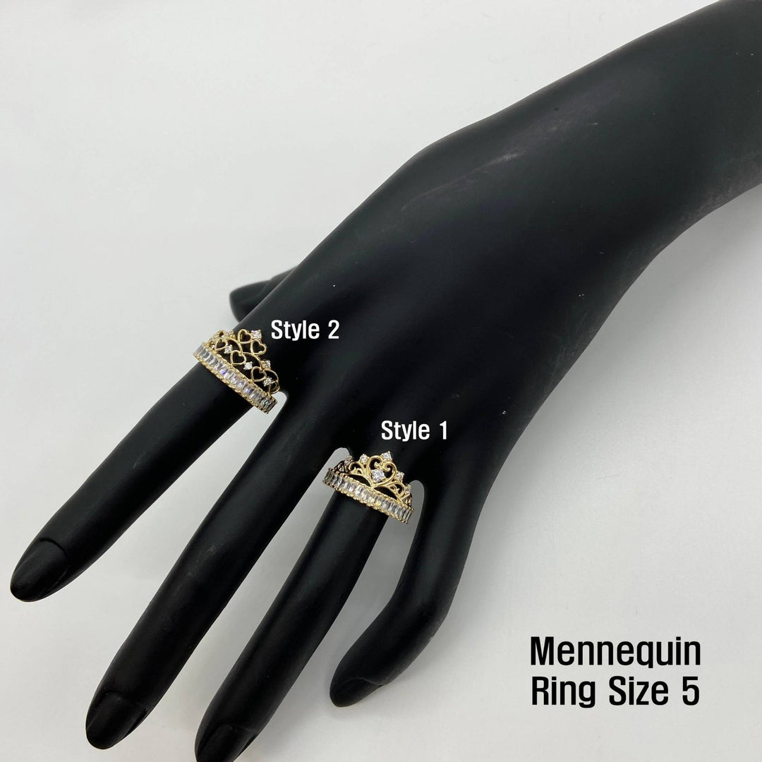 Two 14k gold crown rings on a black mannequin hand with labels for styles and ring size.