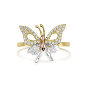 Tricolor gold butterfly ring with cubic zirconia on upper wings and a diamond-cut finish.