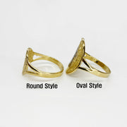 Two 14k gold rings, one round style and one oval style, side view on a white background.