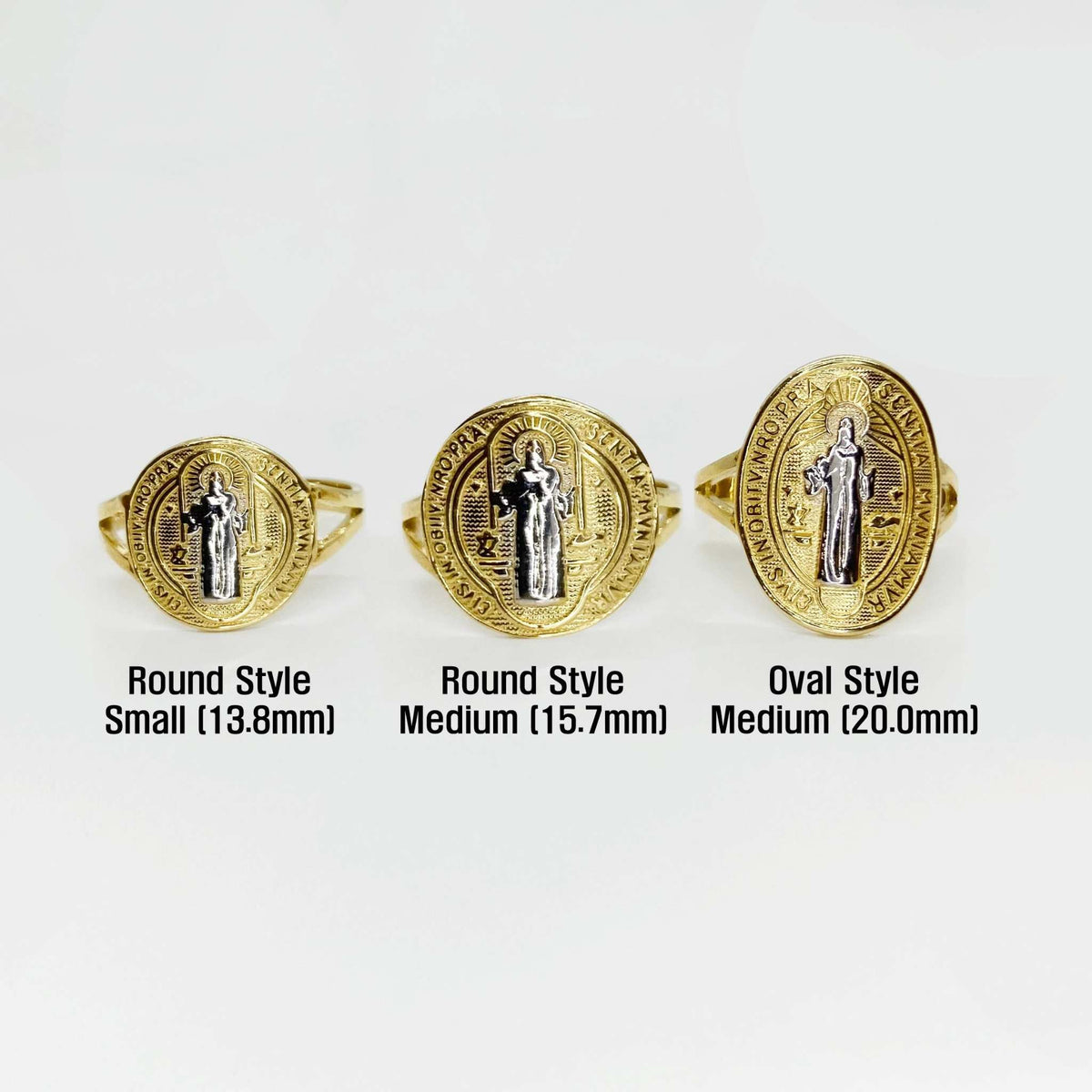 Three 14k gold Saint Benedict rings with different styles and sizes on a white background