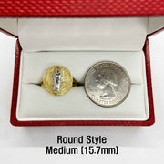 Round style saint benedict medium ring next to a quarter in a red box