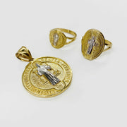 14k Gold pendant and two gold rings with religious designs on a white background