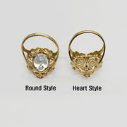 Two 14k gold rings, one round and one heart shaped, back view on a white background.
