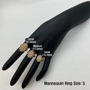Three 14k gold rings on a black mannequin hand with size labels, against a white background.