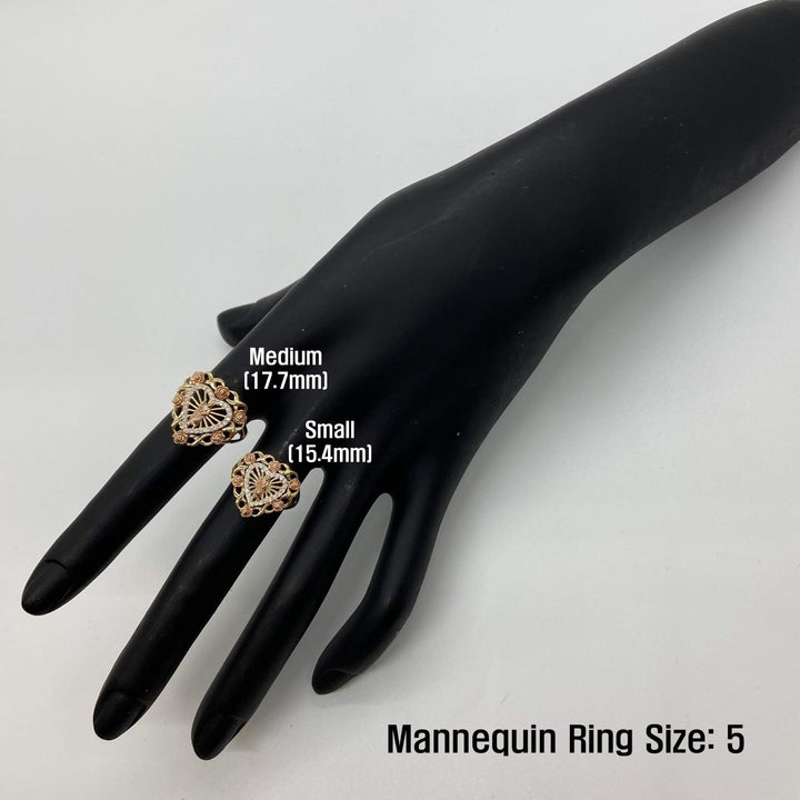 Two 14k gold heart rings on a black mannequin hand with size labels, against a white background
