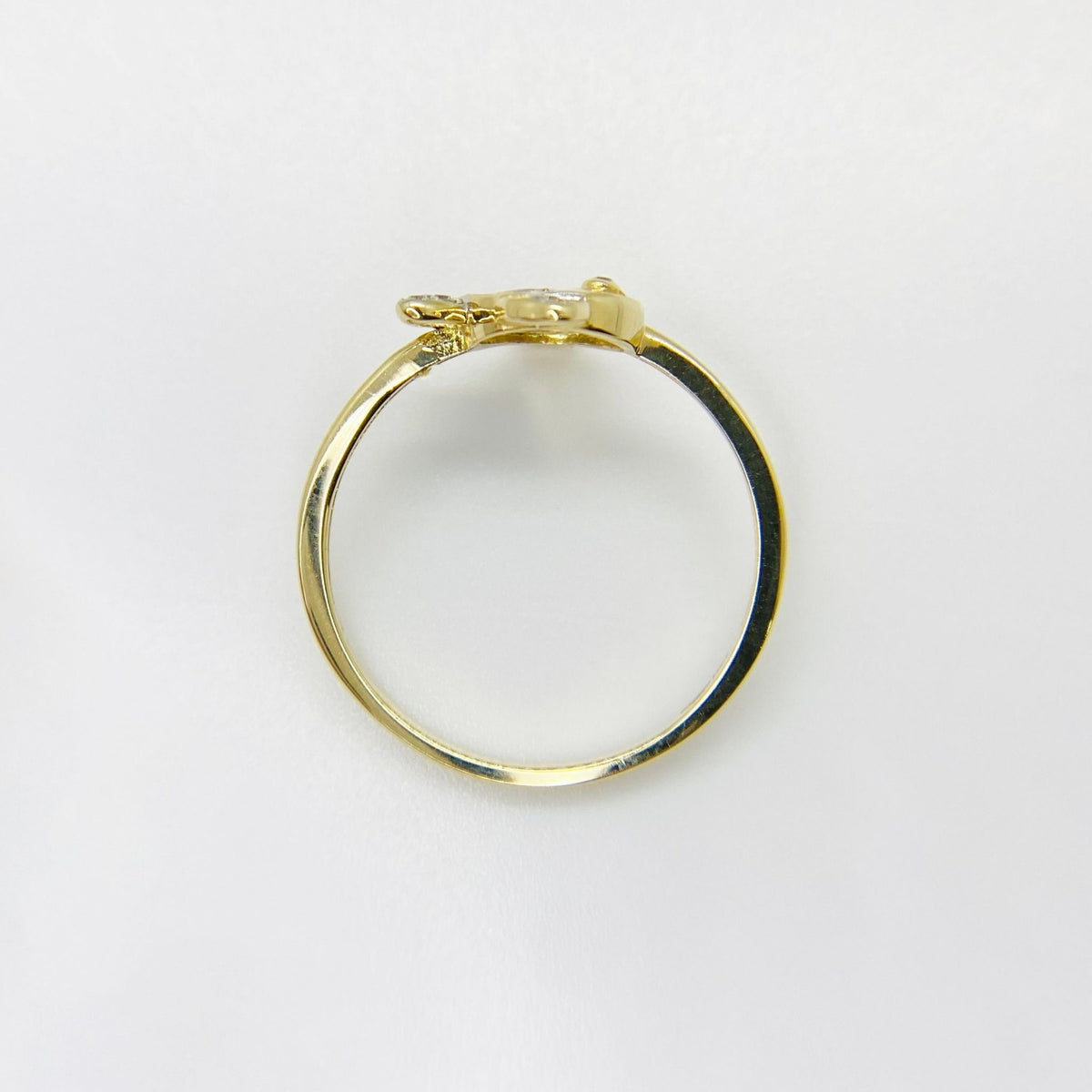 14k Gold ring with fish design top view on a white background