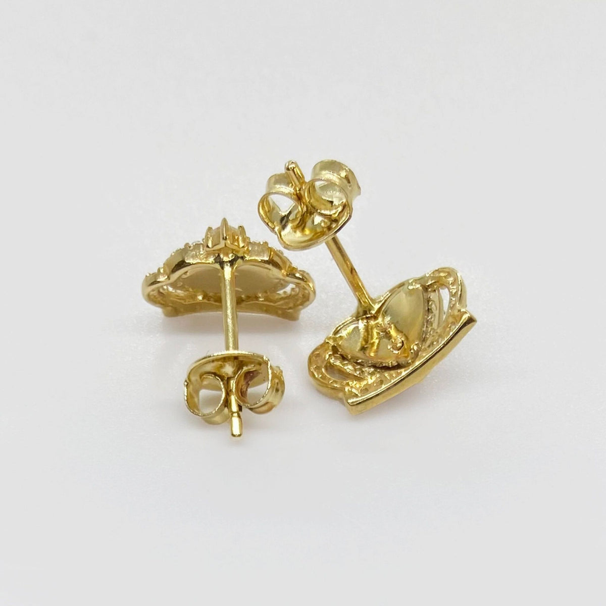 Back view of 14k gold Virgin Mary royal crown stud earrings showing secure earring posts.
