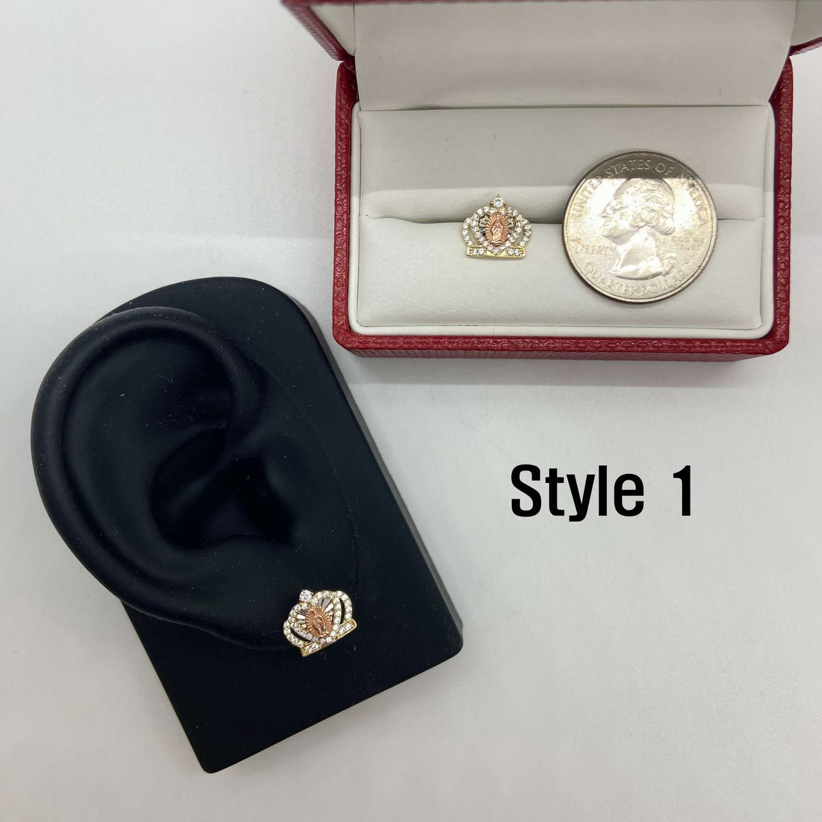 Style 1 14k gold Virgin Mary royal crown stud earring on a display stand with quarter.