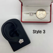 Descriptive: Style 3 14k gold Virgin Mary royal crown stud earring on a display stand with quarter.