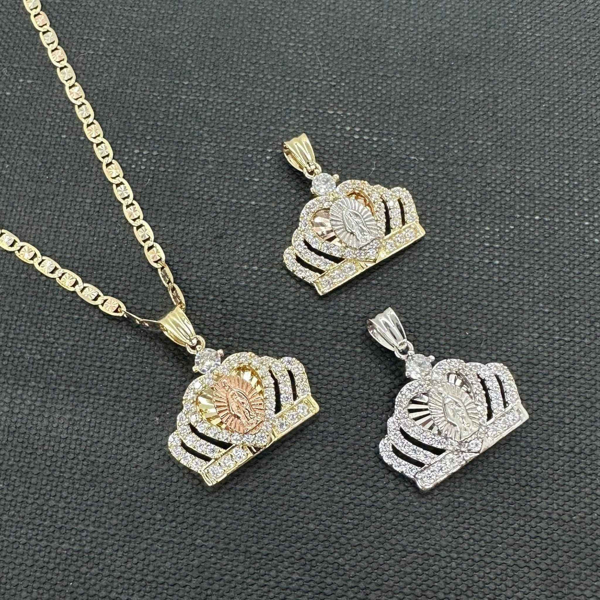Three styles of 14k gold Virgin Mary royal crown CZ pendants shown in yellow gold, rose gold accent, and white gold tones.