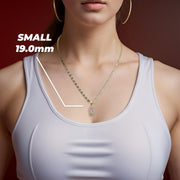 Model wearing Small 19.0mm 14k gold Virgin Mary Guadalupe pendant necklace.