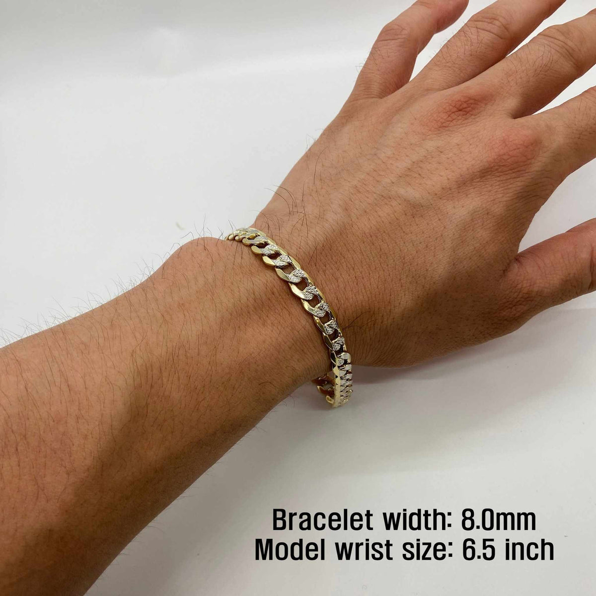 Person wearing 8.0mm 14k gold pave curb link chain bracelet on 6.5 inch wrist.