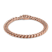 Solid 14k rose gold Miami Cuban link bracelet arranged in a closed oval loop.