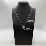 Gold heart pendant necklace on a mannequin display labeled medium 18.2mm and 2.2mm tri-color chain
