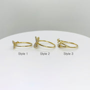 Three 14k gold rings with three different butterfly design side view 