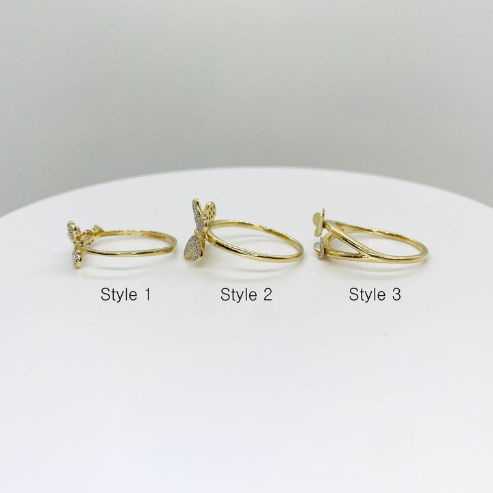 Three 14k gold rings with three different butterfly design side view 